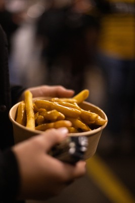 171025 - Dragons RFC v Cardiff Rugby - United Rugby Championship - Fans on the terrace with chips