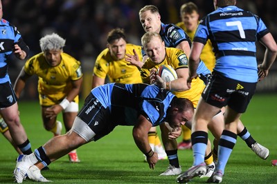 171025 - Dragons RFC v Cardiff Rugby - United Rugby Championship - Tinus De Beer of Dragons is challenged by Corey Domachowski of Cardiff Rugby