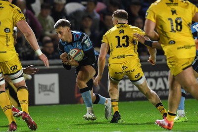171025 - Dragons RFC v Cardiff Rugby - United Rugby Championship - Cam Winnett of Cardiff Rugby is challenged by Aneurin Owen of Dragons