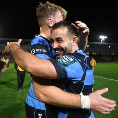 171025 - Dragons RFC v Cardiff Rugby - United Rugby Championship - Liam Belcher of Cardiff Rugby and Josh McNally of Cardiff Rugby celebrate the win at full time