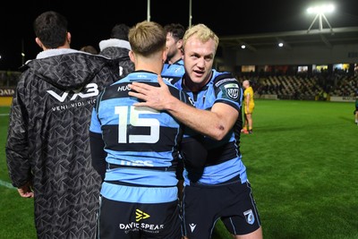 171025 - Dragons RFC v Cardiff Rugby - United Rugby Championship - Cam Winnett of Cardiff Rugby and Johan Mulder of Cardiff celebrate the win at full time