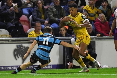 171025 - Dragons RFC v Cardiff Rugby - United Rugby Championship - Rio Dyer of Dragons is challenged by Tom Bowen of Cardiff Rugby