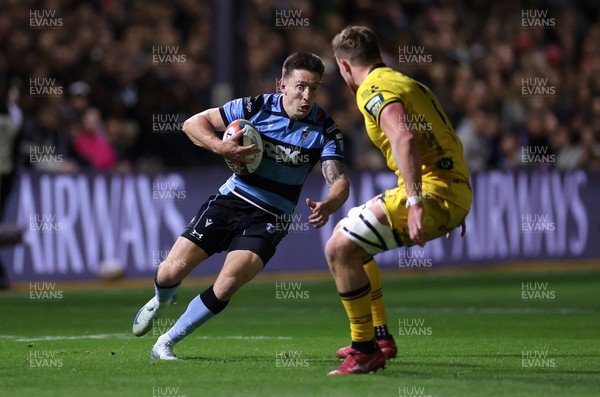 171025 - Dragons RFC v Cardiff Rugby - United Rugby Championship - Josh Adams of Cardiff is challenged by Shane Lewis-Hughes of Dragons 