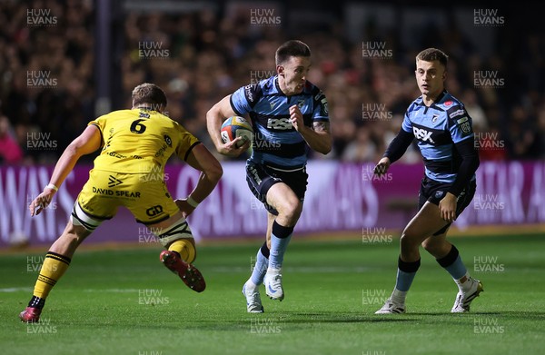 171025 - Dragons RFC v Cardiff Rugby - United Rugby Championship - Josh Adams of Cardiff is challenged by Shane Lewis-Hughes of Dragons 