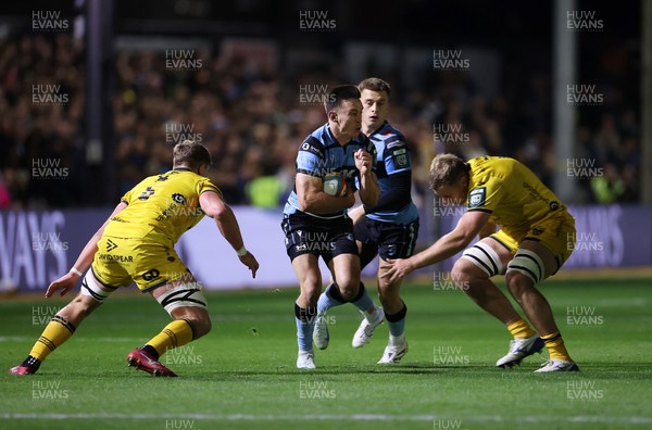 171025 - Dragons RFC v Cardiff Rugby - United Rugby Championship - Josh Adams of Cardiff is tackled by Ben Carter of Dragons 