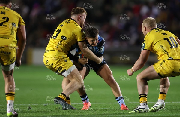 171025 - Dragons RFC v Cardiff Rugby - United Rugby Championship - Callum Sheedy of Cardiff is tackled by Aneurin Owen of Dragons 