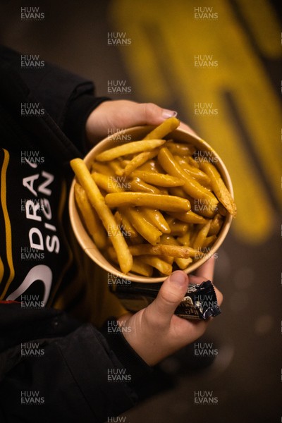 171025 - Dragons RFC v Cardiff Rugby - United Rugby Championship - Fans on the terrace with chips