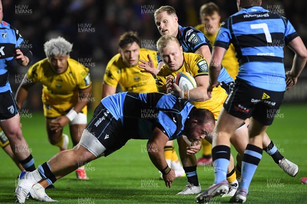 171025 - Dragons RFC v Cardiff Rugby - United Rugby Championship - Tinus De Beer of Dragons is challenged by Corey Domachowski of Cardiff Rugby