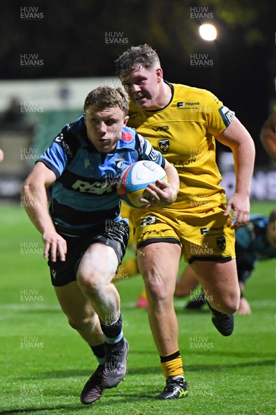 171025 - Dragons RFC v Cardiff Rugby - United Rugby Championship - Tom Bowen of Cardiff Rugby is challenged by Brodie Coghlan of Dragons