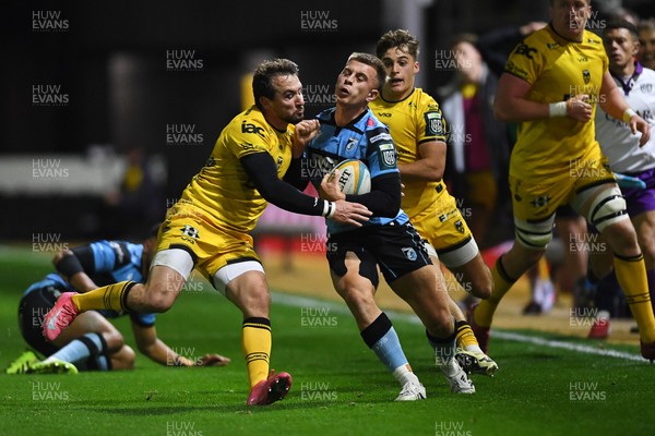 171025 - Dragons RFC v Cardiff Rugby - United Rugby Championship - Cam Winnett of Cardiff Rugby is challenged by Rhodri Williams of Dragons