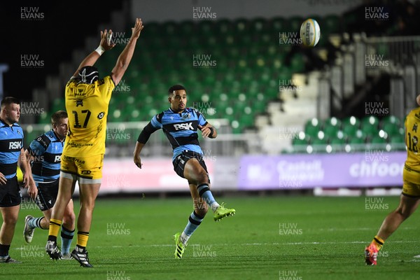 171025 - Dragons RFC v Cardiff Rugby - United Rugby Championship - Ben Thomas of Cardiff Rugby kicks the ball away from Rodrigo Martinez of Dragons