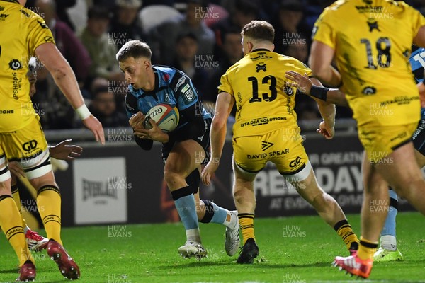 171025 - Dragons RFC v Cardiff Rugby - United Rugby Championship - Cam Winnett of Cardiff Rugby is challenged by Aneurin Owen of Dragons