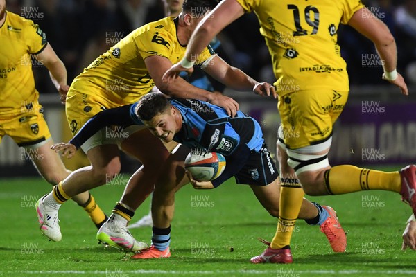 171025 - Dragons RFC v Cardiff Rugby - United Rugby Championship - Callum Sheedy of Cardiff Rugby is challenged by Harri Ackerman of Dragons