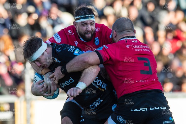 261222 - Dragons RFC v Cardiff Rugby - United Rugby Championship - Aaron Wainwright of Dragons is tackled by Josh Turnbull of Cardiff Rugby and Dmitri Arhip of Cardiff Rugby