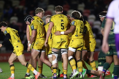 201225 - Dragons RFC v Connacht - United Rugby Championship - Oli Burrows of Dragons celebrates scoring a try with team mates