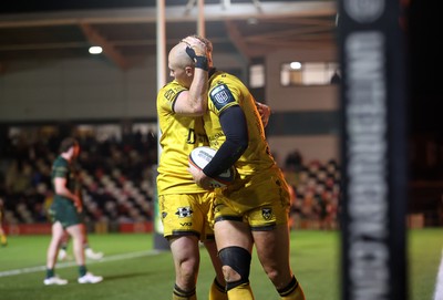 201225 - Dragons RFC v Connacht - United Rugby Championship - Jared Rosser of Dragons celebrates scoring a try with team mates