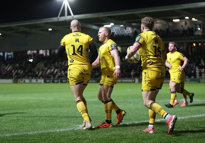 201225 - Dragons RFC v Connacht - United Rugby Championship - Jared Rosser of Dragons celebrates scoring a try with team mates