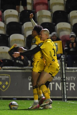 201225 - Dragons RFC v Connacht - United Rugby Championship - Rio Dyer of Dragons celebrates scoring a try with team mates