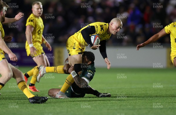 201225 - Dragons RFC v Connacht - United Rugby Championship - Jared Rosser of Dragons is tackled by Bundee Aki of Connacht 