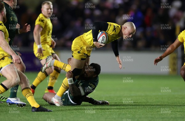 201225 - Dragons RFC v Connacht - United Rugby Championship - Jared Rosser of Dragons is tackled by Bundee Aki of Connacht 