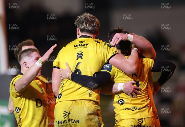 201225 - Dragons RFC v Connacht - United Rugby Championship - Che Hope of Dragons celebrates scoring a try with team mates