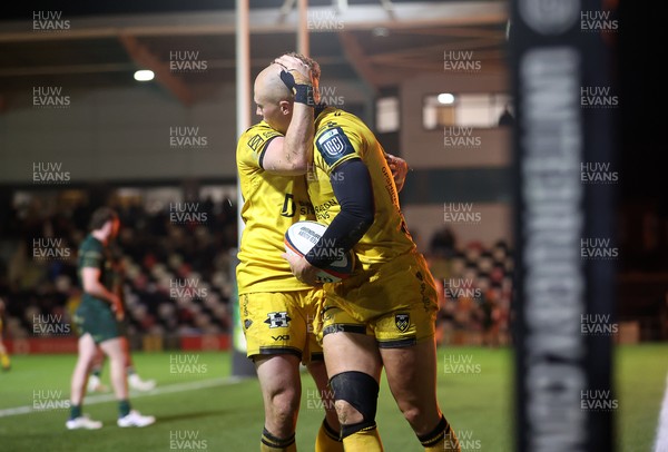 201225 - Dragons RFC v Connacht - United Rugby Championship - Jared Rosser of Dragons celebrates scoring a try with team mates