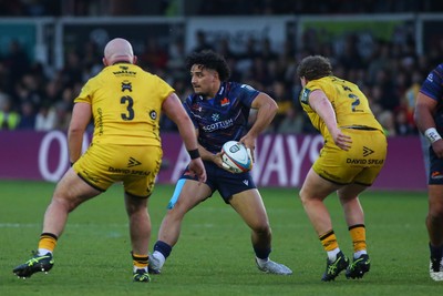 090526 - Dragons RFC v Edinburgh Rugby - United Rugby Championship - Mosese Tuipulotu of Edinburgh under pressure from Dillon Lewis (3) and Brodie Coghlan of Dragons