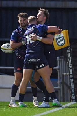 090526 - Dragons RFC v Edinburgh Rugby - United Rugby Championship - Duhan Van Der Merwe of Edinburgh celebrates scoring a try with team mates