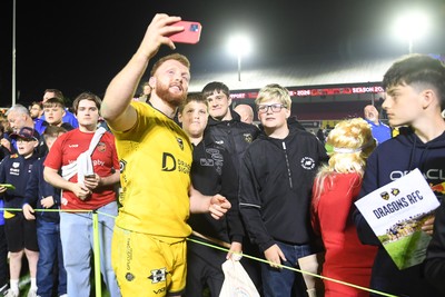 090526 - Dragons RFC v Edinburgh Rugby - United Rugby Championship - Aneurin Owen of Dragons with fans at full time