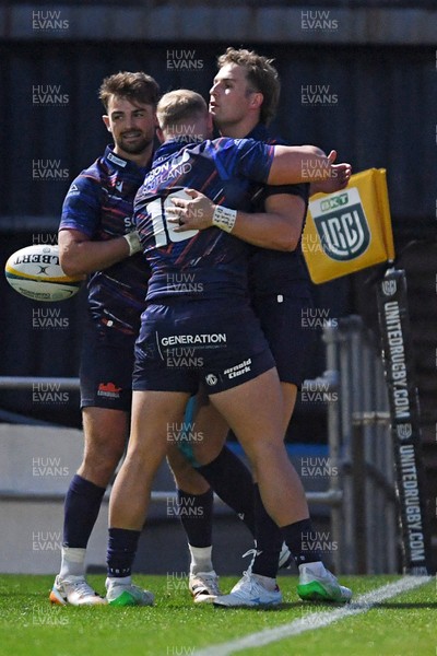 090526 - Dragons RFC v Edinburgh Rugby - United Rugby Championship - Duhan Van Der Merwe of Edinburgh celebrates scoring a try with team mates