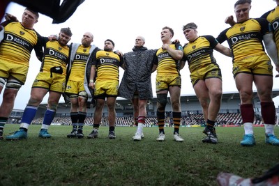 160225 - Dragons RFC v Glasgow Warriors - United Rugby Championship - Dragons team huddle at full time