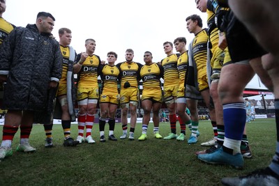 160225 - Dragons RFC v Glasgow Warriors - United Rugby Championship - Dragons team huddle at full time