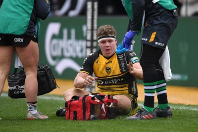 160225 - Dragons RFC v Glasgow Warriors - United Rugby Championship - Brodie Coughlan of Dragons goes down to receive treatment