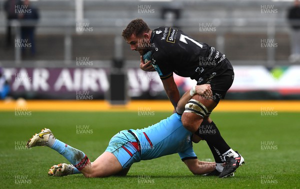 280123 - Dragons v Glasgow - United Rugby Championship - Sean Lonsdale of Dragons is tackled by Sam Johnson of Glasgow