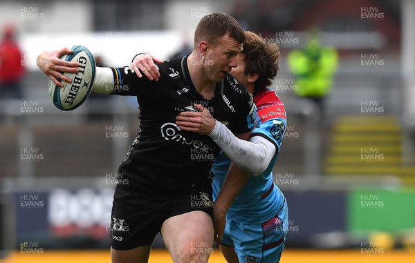 280123 - Dragons v Glasgow - United Rugby Championship - Jack Dixon of Dragons is tackled by Sebastian Cancelliere of Glasgow