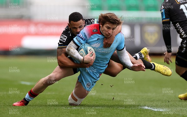 280123 - Dragons RFC v Glasgow Warriors - United Rugby Championship - Sebastian Cancelliere of Glasgow is tackled by Ashton Hewitt of Dragons