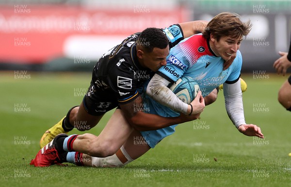 280123 - Dragons RFC v Glasgow Warriors - United Rugby Championship - Sebastian Cancelliere of Glasgow is tackled by Ashton Hewitt of Dragons