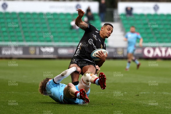 280123 - Dragons RFC v Glasgow Warriors - United Rugby Championship - Ashton Hewitt of Dragons is tackled by Sebastian Cancelliere of Glasgow