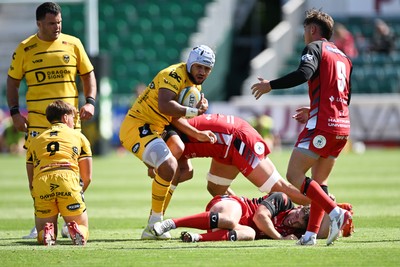 050926 - Dragons RFC v Hartpury, Preseason Friendly - Anzelo Tu’itavuki of Dragons is challenged by Sam Alford of Hartpury