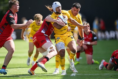 050926 - Dragons RFC v Hartpury, Preseason Friendly - Anzelo Tu’itavuki of Dragons is challenged by Sam Alford of Hartpury