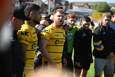 050926 - Dragons RFC v Hartpury, Preseason Friendly - Aneurin Owen of Dragons leads the team huddle at full time