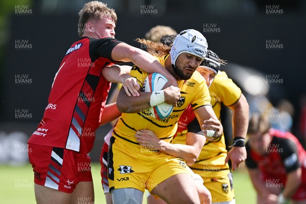 050926 - Dragons RFC v Hartpury, Preseason Friendly - Anzelo Tu’itavuki of Dragons is challenged by Harrison Bellmay of Hartpury