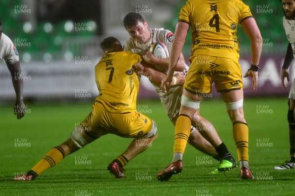 031025 - Dragons RFC v Hollywoodbets Sharks - United Rugby Championship - Jean Smith of Sharks is challenged by Shane Lewis-Hughes of Dragons
