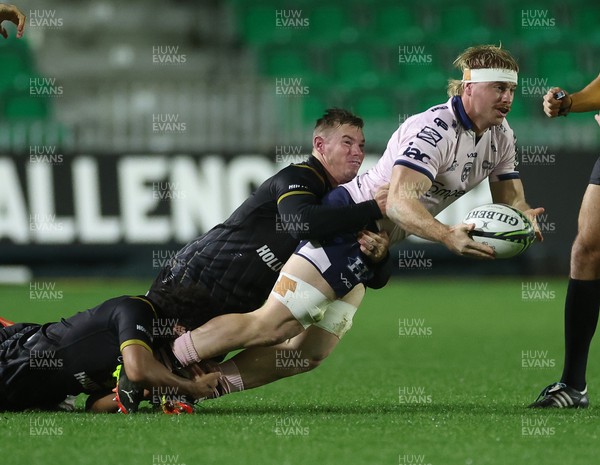 210124 - Dragons RFC v Hollywoodbets Sharks, EPCR Challenge Cup - Aaron Wainwright of Dragons offloads as he is tackled