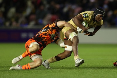141225 - Dragons RFC v Lyon Olympique Universitaire - European Rugby Challenge Cup - Marvin Okuya of Lyon is tackled by Thomas Young of Dragons 