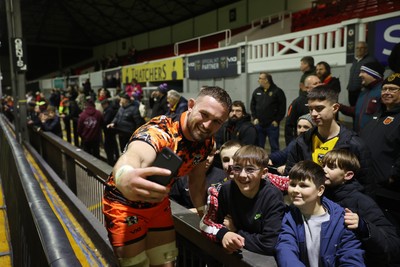 141225 - Dragons RFC v Lyon Olympique Universitaire - European Rugby Challenge Cup - Harri Keddie of Dragons with fans at full time