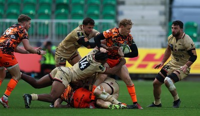 141225 - Dragons RFC v Lyon Olympique Universitaire, EPCR Challenge Cup - David Richards of Dragons is held by Dorian Diabou of Lyon