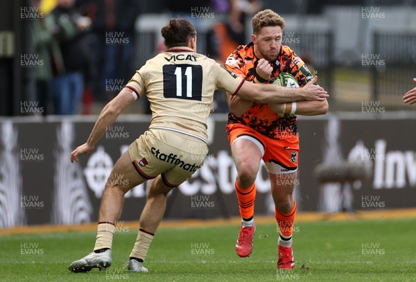 141225 - Dragons RFC v Lyon Olympique Universitaire - European Rugby Challenge Cup - Angus O�Brien of Dragons is tackled by Arthur Mathiron of Lyon 