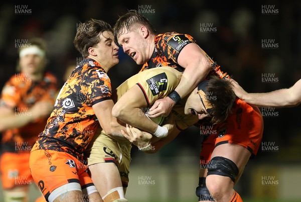 141225 - Dragons RFC v Lyon Olympique Universitaire - European Rugby Challenge Cup - Bartholome Sanson of Lyon is tackled by Huw Anderson and Matthew Screech of Dragons 