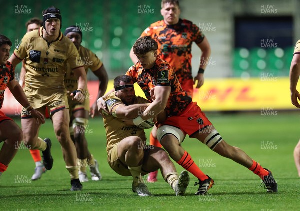 141225 - Dragons RFC v Lyon Olympique Universitaire, EPCR Challenge Cup - Jerome Rey of Lyon is tackled by Ryan Woodman of Dragons